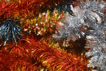 colorful tinsel for christmas and new year background, close up