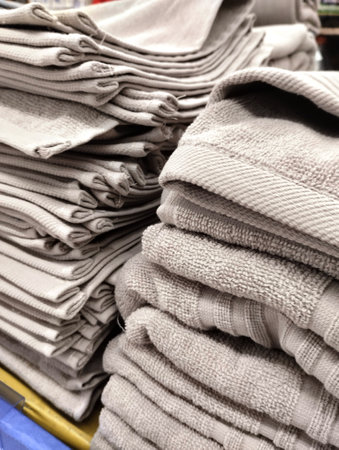 Stacks of folded towels in the store. Shallow depth of fieldの写真素材