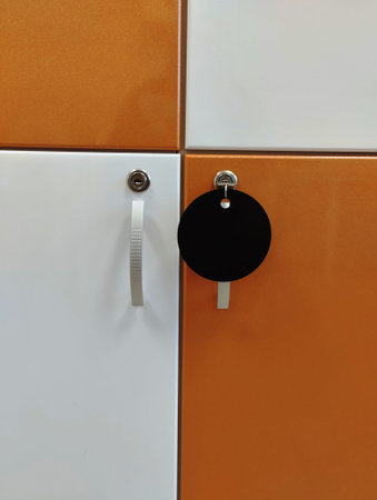 Close up of a locker in a locker room with lockers.