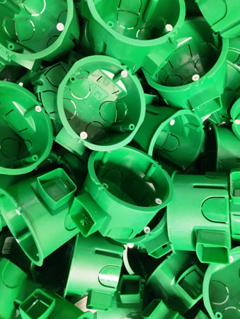 Green plastic pipe caps for plumbing and piping work. Close up.