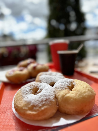 Donuts with jam on the table in a cafe. Selective focus.の写真素材