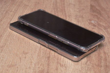Smartphone on wooden background. Smartphone on the table. Mobile phone.