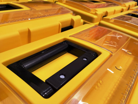 close up of yellow plastic waste bins in a recycling center ready for recycling