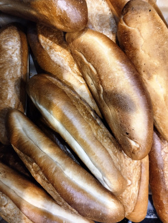 Freshly baked baguettes on the counter in the bakery.