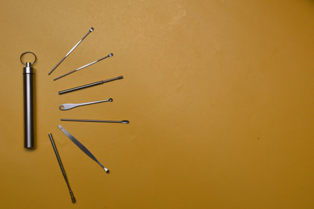 Set of dental tools on a yellow background. Top view. Copy space.の写真素材