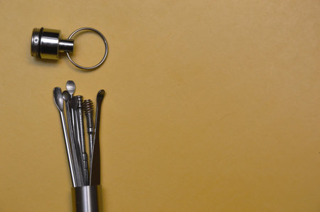 Dental tools on a yellow background. Top view. Copy space.の写真素材