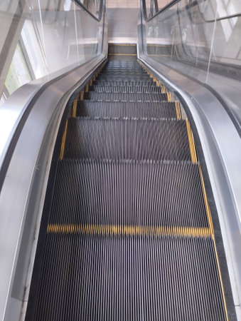 Escalator in a modern office building, closeup of photoの写真素材
