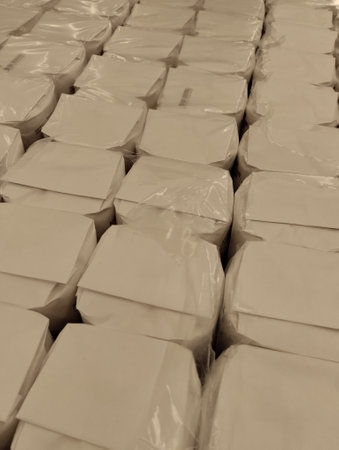 cubes of cheese stacked in a warehouse, closeup of photoの写真素材
