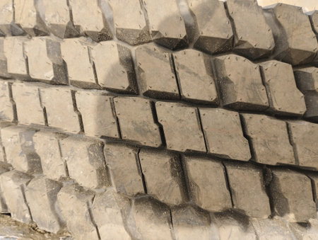 tire treads in a construction site, closeup of photoの写真素材