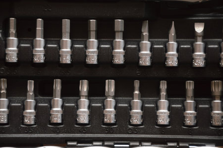 Set of screwdriver bits in a box. Close-up.