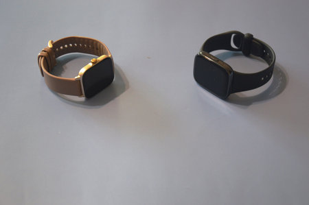 Black and brown smart watch on a white background. Isolated.