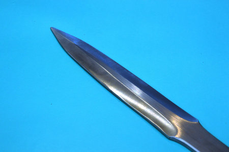Knife on a blue background, close up of a knife.