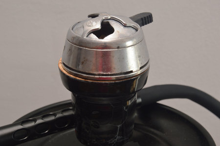 Coffee grinder on a gray background, close-up