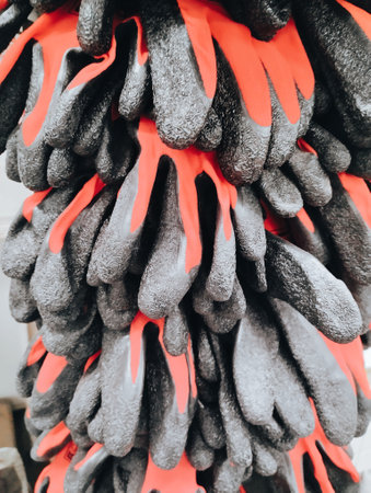 Close up of a pile of black rubber gloves for cleaning in the streetの写真素材
