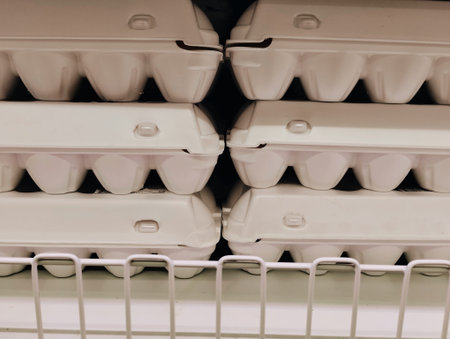 Closeup of white plastic containers for food in supermarket. Selective focus.