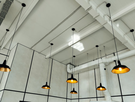 Modern ceiling lamps on the ceiling of the building. 3d renderingの写真素材