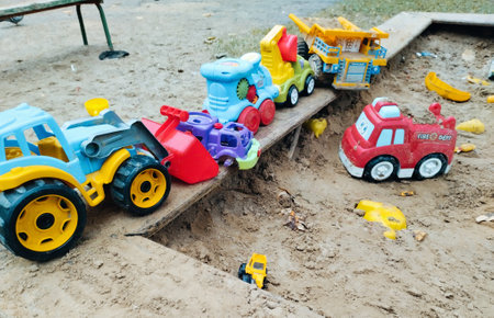 Children's toys in the sandbox. The concept of childhood and leisure.の写真素材