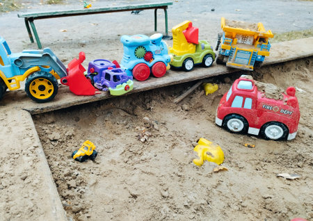 toy car on the sand in the park. toys in the sandbox