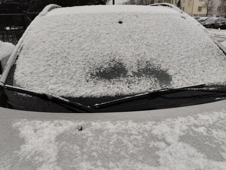 Snow on the windshield of a car after a heavy snowfall.の写真素材