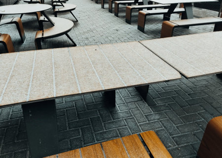 Empty tables and chairs in a street cafe. Selective focus.の写真素材