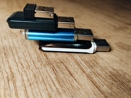 Usb flash drives on a wooden table. Shallow depth of field.の写真素材