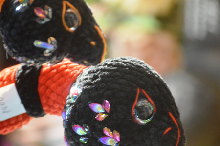 Handmade crochet dolls in a shop, closeup of photoの写真素材