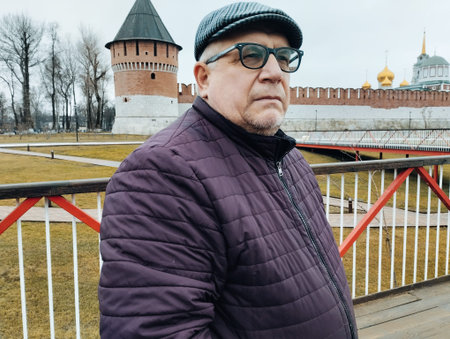 Portrait of an elderly man on the background of the Kremlin.の写真素材