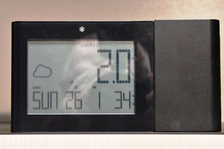 Closeup of digital alarm clock showing time of 10 am or pmの写真素材