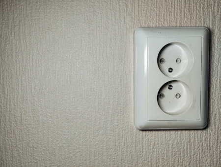 Electrical socket on the wall. Selective focus. Toned.の写真素材