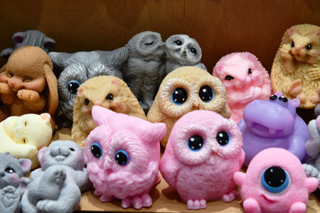 Cute handmade toys in the form of owls, cats and dogsの写真素材