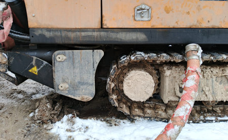 part of the excavator in the snow, closeup of photo