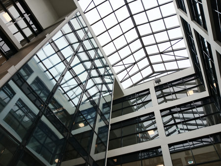 Glass facade of modern office building. Architectural detail of modern office building.