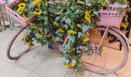 Bicycle decorated with sunflowers in flower shop, Thailand.の写真素材