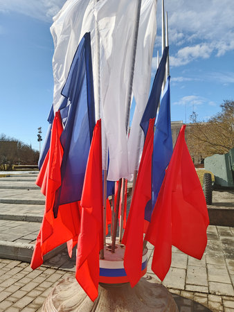 The flags of the Russian Federation against the background of a blue sky