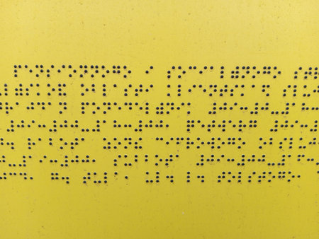 Text on a yellow metal surface. Abstract background and texture for design.