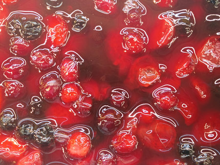 Cranberry jam in the water, close-up, background