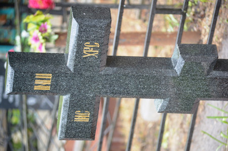 Grave stone in the cemetery, selective focus and shallow depth of field.