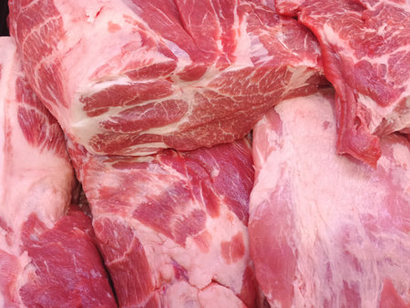 Pork meat on display in a butcher shop, closeup of photoの写真素材