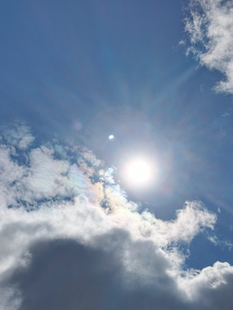 Blue sky with white clouds and sun rays. The vast blue sky and clouds sky on sunny day.