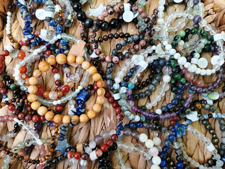 colorful necklaces on a market stall, closeup of photo