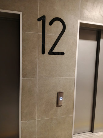 Interior of an office building with elevator and emergency exit