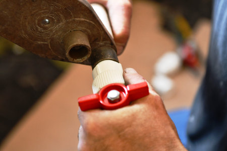 hand of a craftsman working with a tool, closeup of photo