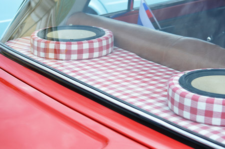 Closeup of a checkered tablecloth on a red carの写真素材