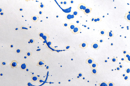 Blue and white watercolor pattern on white paper. Abstract background.