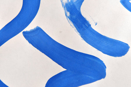 Abstract hand painted blue watercolor background. Texture of strokes of colored paint on paper.の写真素材