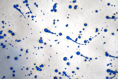 Abstract background of blue and white ink spots on white paper. Macro photography.の写真素材