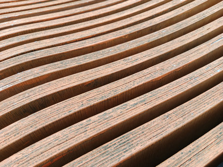 abstract background of a wooden bench in a park, closeup of photoの写真素材