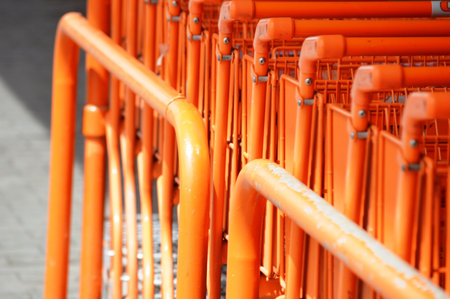 Orange shopping cards in the shopping center. Shallow depth of field.の写真素材