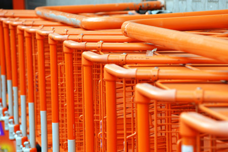 Orange shopping cards for sale in a supermarket, closeup of photo