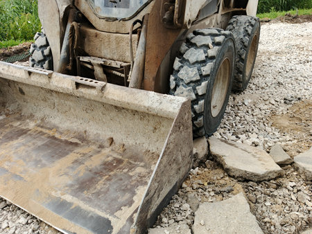 Bulldozer on a construction site. Backhoe digs the ground.